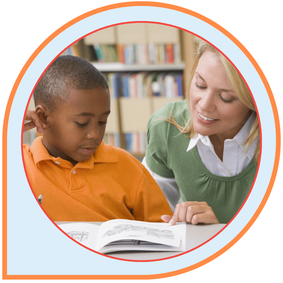Teacher reading with a student